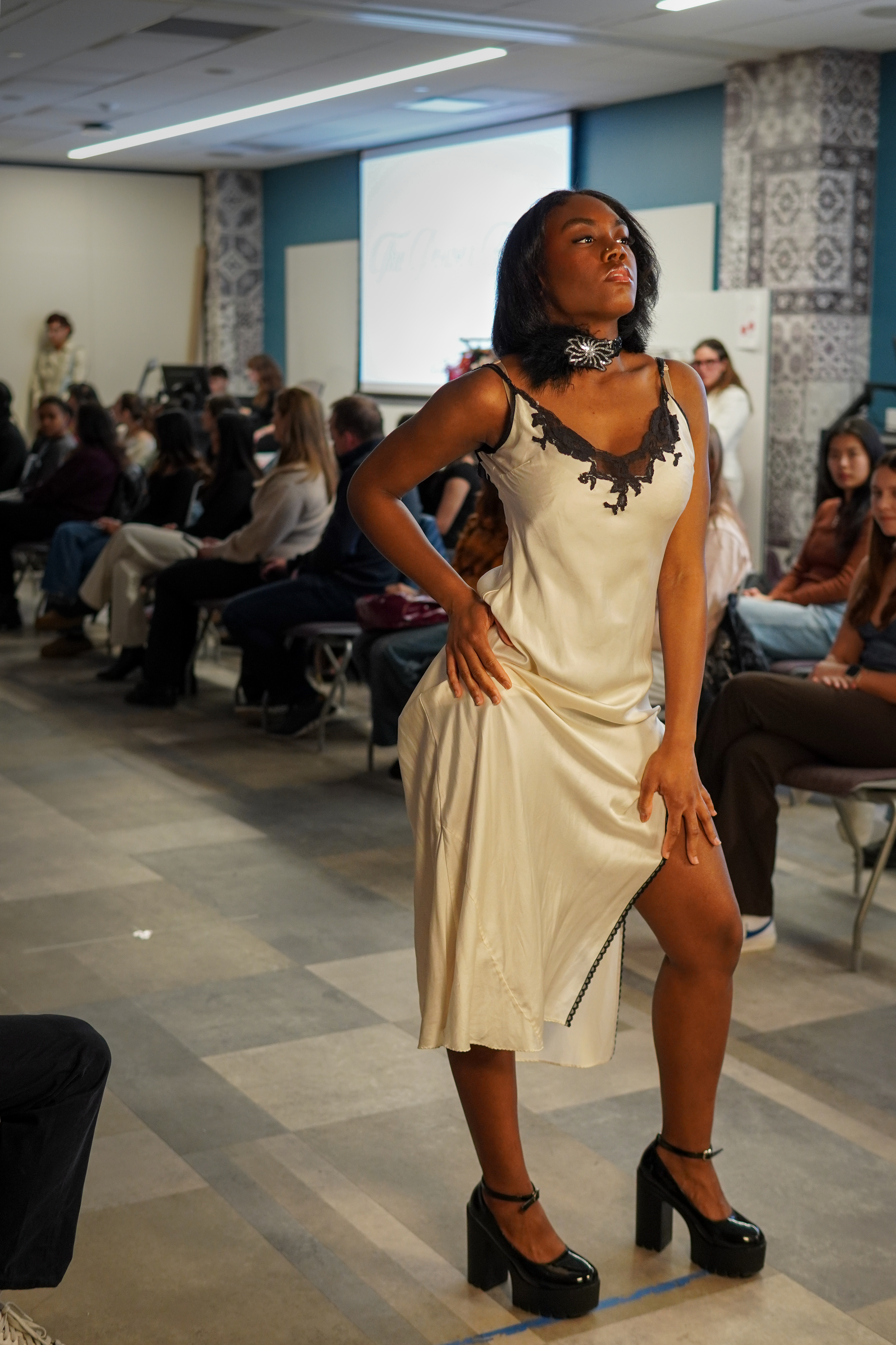 Noir runway model in a vertical fashion frame.
