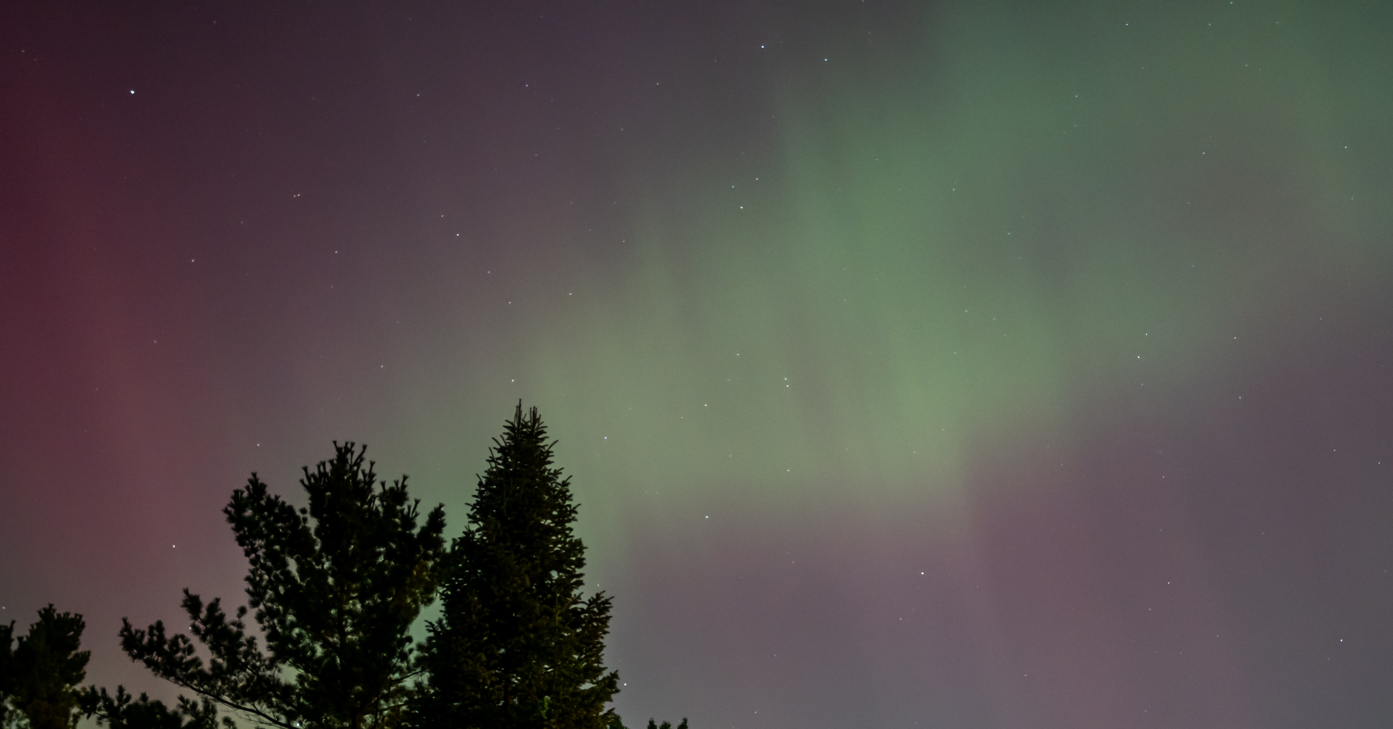 Northern Michigan night sky with aurora color.